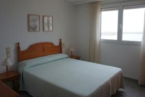 Postel nebo postele na pokoji v ubytování Apartamento dos dormitorios, primera línea y aire acondicionado