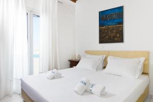 Een bed of bedden in een kamer bij Villa Miglia by Whitelist Mykonos