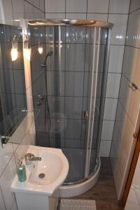 a bathroom with a shower and a sink at Pokój w Karpaczu in Karpacz