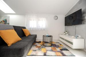 TV a/nebo společenská místnost v ubytování Apartman Marta