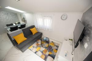 TV a/nebo společenská místnost v ubytování Apartman Marta