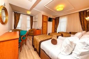 Postel nebo postele na pokoji v ubytování Santa Ottoman Hotel