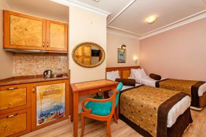 Kuchyň nebo kuchyňský kout v ubytování Santa Ottoman Hotel