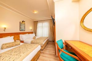 Postel nebo postele na pokoji v ubytování Santa Ottoman Hotel