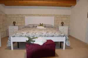 מיטה או מיטות בחדר ב-Il Carrubo Holiday House