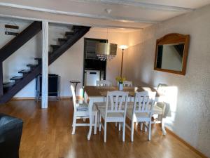 a dining room with a table and chairs at Joline private guest apartment feel like home in Nidau