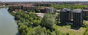 an aerial view of a city with a river and buildings at Residence all'Adige in Verona