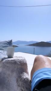 a cup of coffee sitting on top of a table at Villetta Erato,picturesque studio in Chalki in Halki