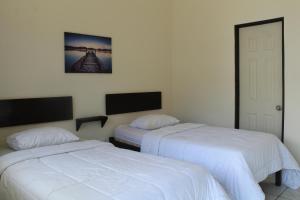 Voodi või voodid majutusasutuse Hotel Cañas toas