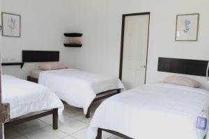 Voodi või voodid majutusasutuse Hotel Cañas toas