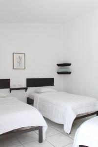Voodi või voodid majutusasutuse Hotel Cañas toas