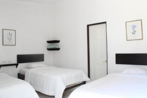 Voodi või voodid majutusasutuse Hotel Cañas toas