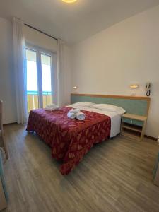 Postel nebo postele na pokoji v ubytování Hotel Artide
