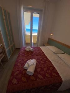 Postel nebo postele na pokoji v ubytování Hotel Artide