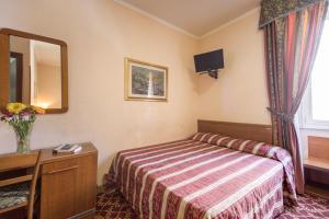 Postel nebo postele na pokoji v ubytování Buonarroti Home