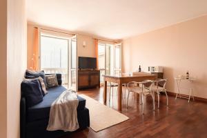 a living room with a couch and a table at Residenza Santa Cecilia in San Vincenzo