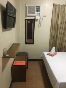 TV a/nebo společenská místnost v ubytování Isteraha Haven&Suites