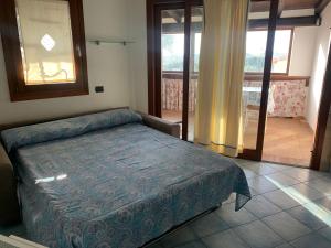 מיטה או מיטות בחדר ב-VILLINO FIORI DI BARAGGE