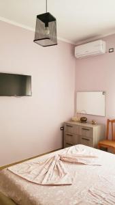 Postel nebo postele na pokoji v ubytování Louis Appartment