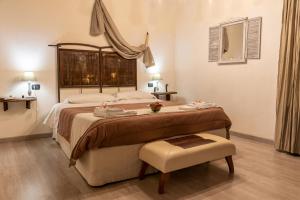 A bed or beds in a room at Torre della Botonta