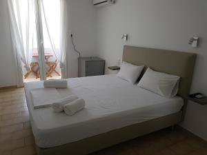 Ένα ή περισσότερα κρεβάτια σε δωμάτιο στο Hotel Elafonisos