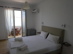 Ένα ή περισσότερα κρεβάτια σε δωμάτιο στο Hotel Elafonisos