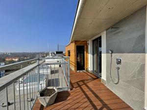 a balcony with a shower on the side of a building at Magic Apartment centre mezonet in Plzeň