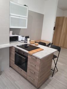 Kuchyň nebo kuchyňský kout v ubytování @home Napoli