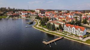 an aerial view of a town next to a body of water at VillaRyn in Ryn