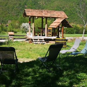 two chairs and a gazebo in a yard at Etno Konak Angela in Kalna