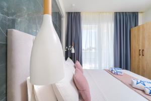 Posteľ alebo postele v izbe v ubytovaní Hotel ASTERA