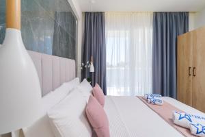 Posteľ alebo postele v izbe v ubytovaní Hotel ASTERA