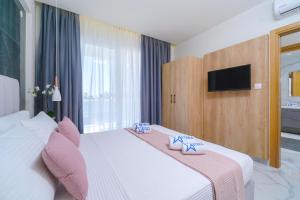 Posteľ alebo postele v izbe v ubytovaní Hotel ASTERA