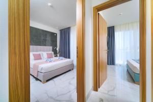 Posteľ alebo postele v izbe v ubytovaní Hotel ASTERA