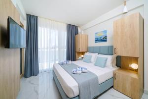 Posteľ alebo postele v izbe v ubytovaní Hotel ASTERA