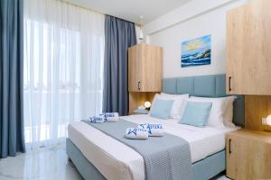 Posteľ alebo postele v izbe v ubytovaní Hotel ASTERA