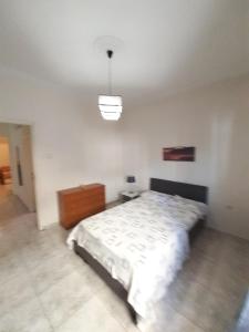 Posteľ alebo postele v izbe v ubytovaní Asteris appartment