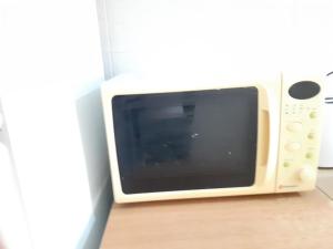 Televízia a/alebo spoločenská miestnosť v ubytovaní Asteris appartment