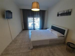Posteľ alebo postele v izbe v ubytovaní Asteris appartment
