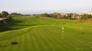an aerial view of a green golf course at Praia Del Rey ByThe Pools in Casal da Lagoa Seca