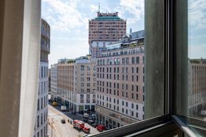 a view of a city street from a window at Missori Suites in Milan