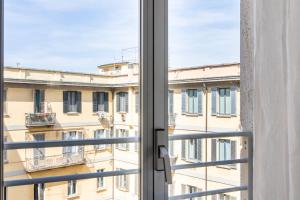 an open window with a view of a building at Missori Suites in Milan