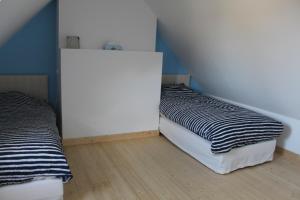 Un ou plusieurs lits dans un hébergement de l'établissement Maison Belle-Ile en Mer
