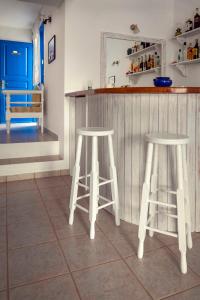 a white refrigerator sitting in a kitchen next to a counter at Meltemi in Chora Folegandros