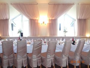 a conference room with a table and chairs in it at Bogema Motel in Solonka