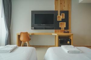 TV a/nebo společenská místnost v ubytování The Cotton Tree Hometel