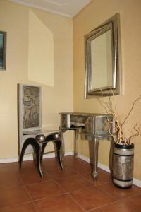 a bathroom with a sink and a mirror at Hotel Garni Rimski in Novi Sad