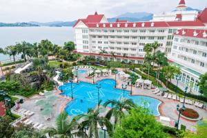 an aerial view of the resort with a large pool at Hong Kong Disneyland Hotel in Hong Kong