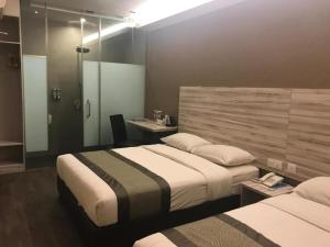Postel nebo postele na pokoji v ubytování Hotel Austin Paradise - Taman Pulai Utama