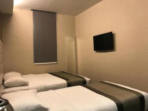 Postel nebo postele na pokoji v ubytování Hotel Austin Paradise - Taman Pulai Utama